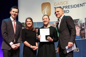 Dervla receiving her award with Adam Harris from 'As I Am', Yvonne McKenna Gaisce awards CEO, Ireland and Leinster rugby fly half Ian Madigan 